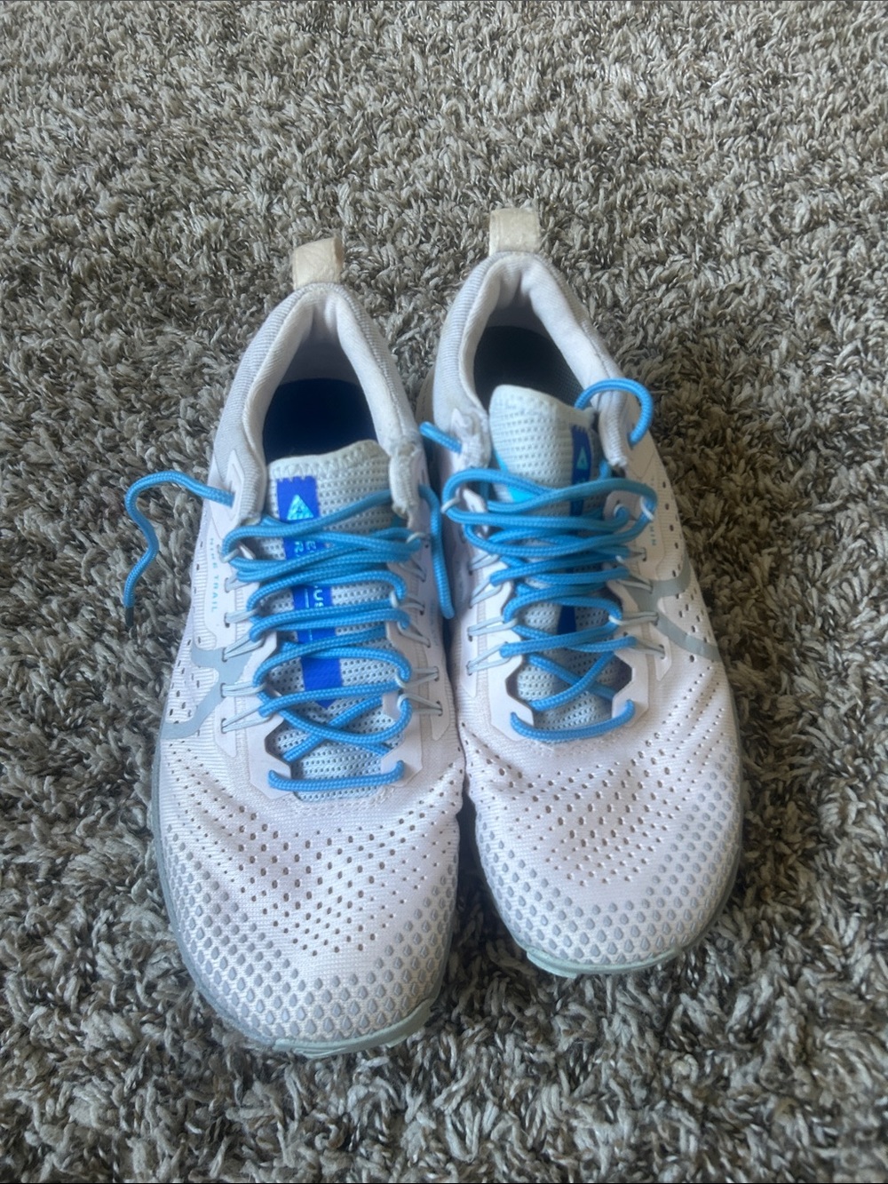 Nike Women's White Athletic Sneakers with Blue Accents
